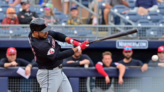 Feb 26, 2024; Peoria, Arizona, USA; Cleveland Guardians right fielder Ramon Laureano (10) singles in the first inning against the San Diego Padres during a spring training game at Peoria Sports Complex. Mandatory Credit: Matt Kartozian-USA TODAY Sports